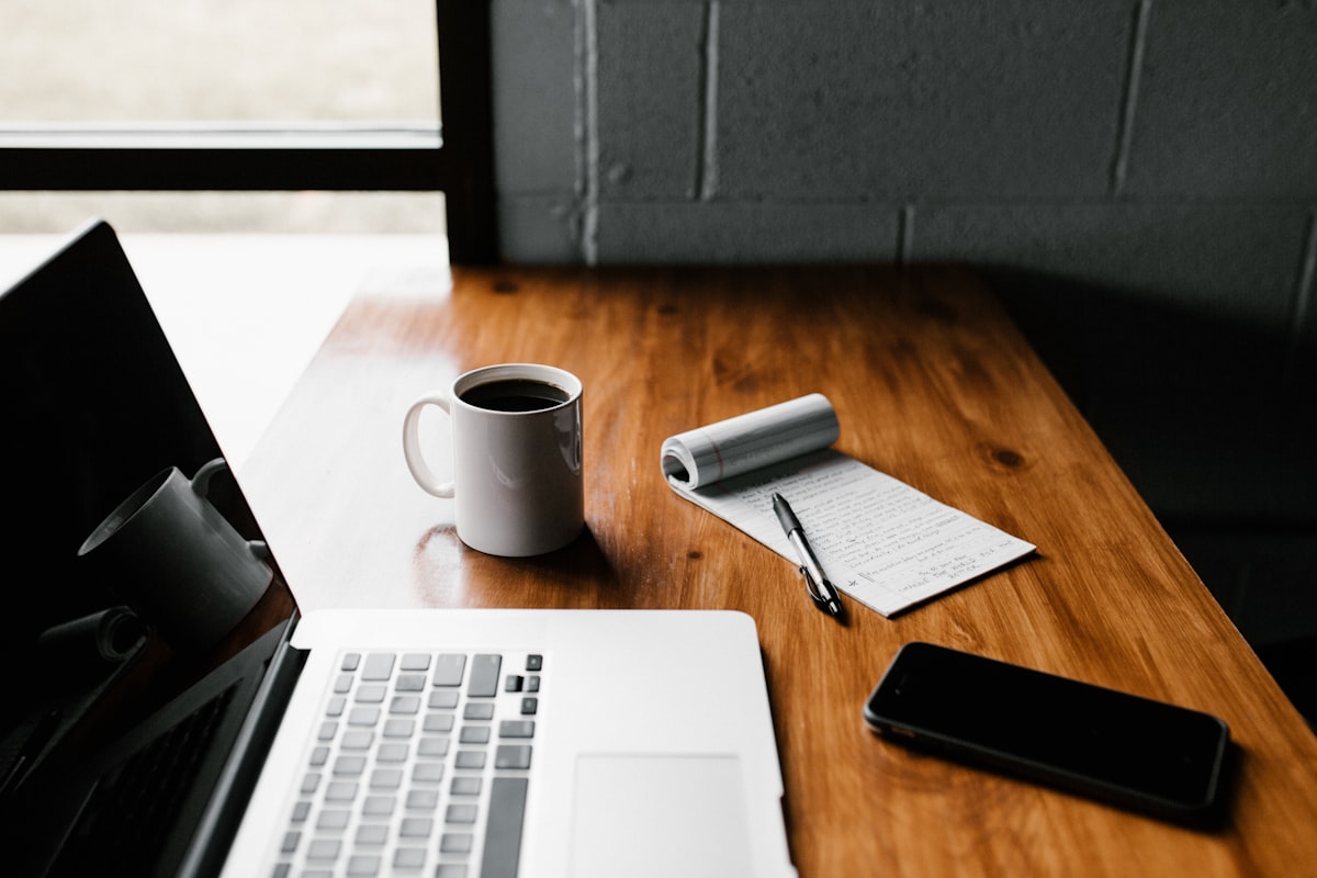Professional reviewing LinkedIn profile mistakes on laptop — LinkedIn branding tips by Ajlal Haider