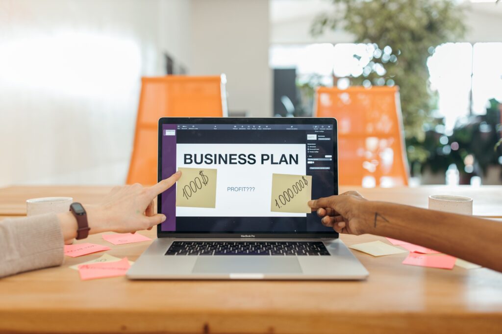 Business professionals reviewing a founder LinkedIn profile and personal branding strategy